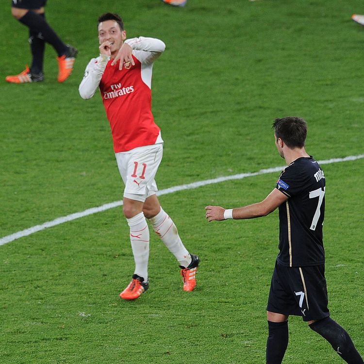 cover art for Ozil and Alexis goals keep Champions League hopes alive