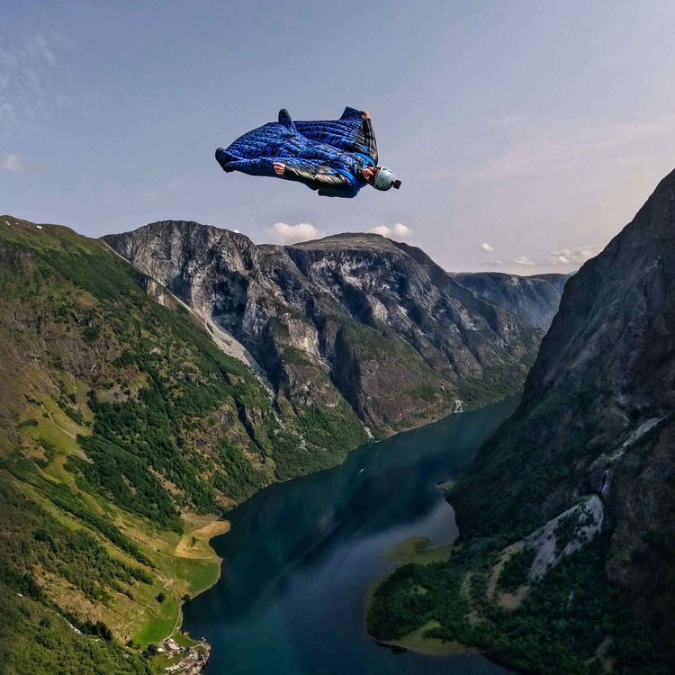 cover art for #38: The Dream of Human Flight – Base Jumping & Wingsuit Flying with Christina Clusiau, Shaul Schwarz, Amber Forte & Espen Fadnes