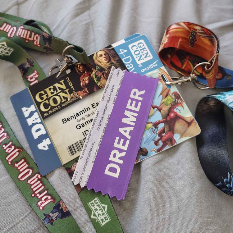 cover art for Episode 186: Gen Con Badges and Housing Lottery