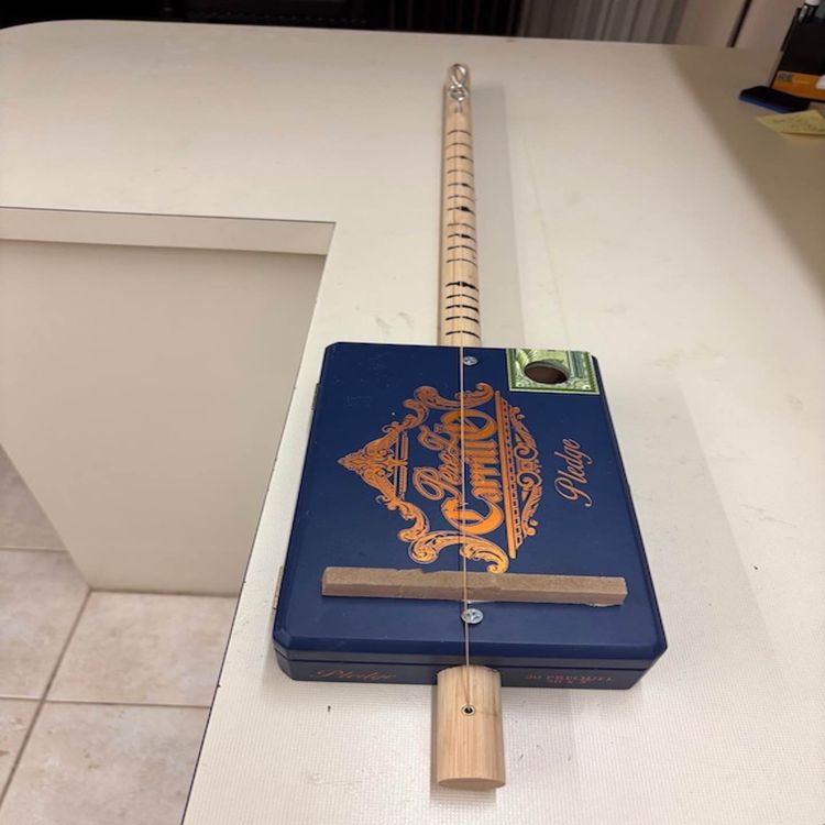 cover art for Blues riffs on an acoustic cigar box Diddley bow